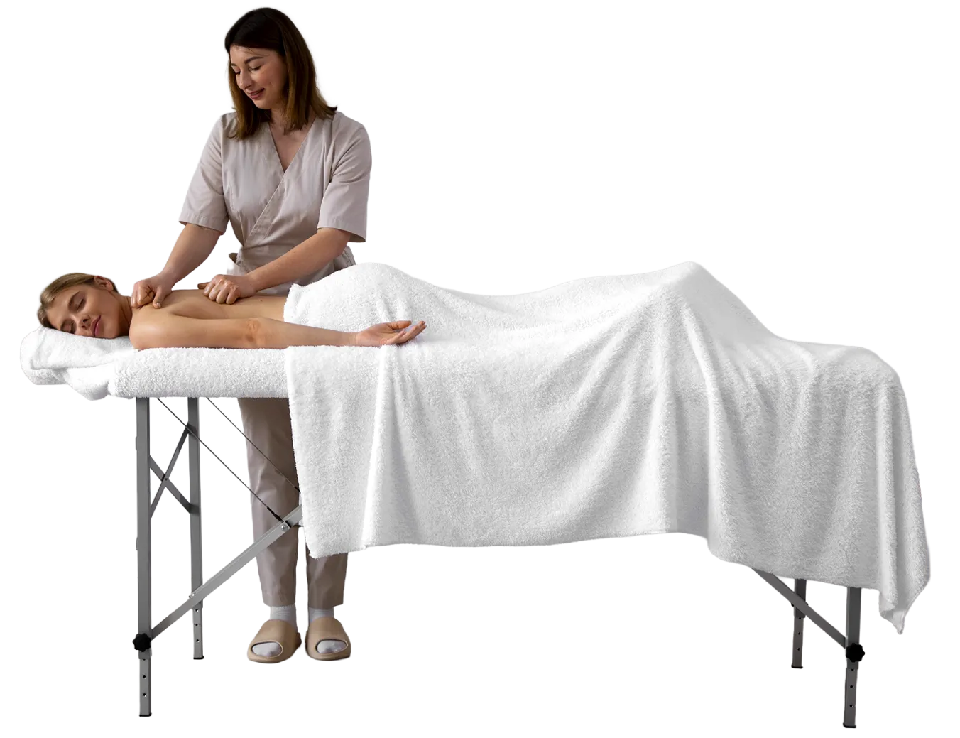 massage therapist treating client on table